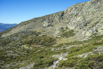 Glacial lagoon next to the Pico del Nevero (Snowfield Peak; 2.209 metres), in Guadarrama Mountains National Park, Madrid, Spain