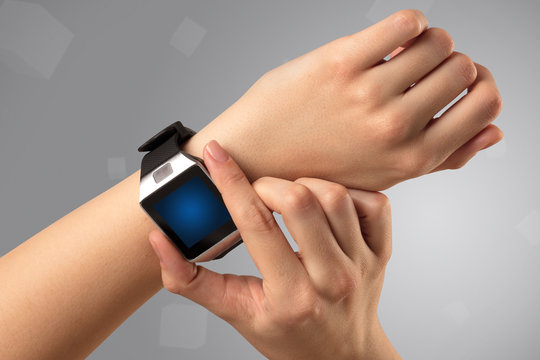 Female hand wearing smartwatch