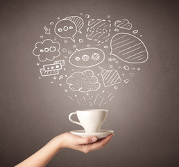 Female hand holding coffee cup