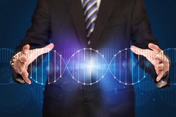 Businessman holding DNA