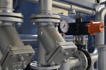Steam piping with fittings on a machine