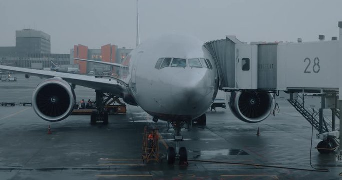 MOSCOW, RUSSIA - MARCH 08, 2017: Airplane with attached airbridge being on service before boarding. Departure from Sheremetyevo International Airport