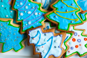Christmas background with homemade gingerbreads.Christmas trees cookies icing. Xmas card.Holiday dessert.