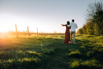 Young couple walking together at vineyard