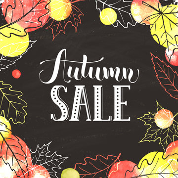 Autumn sale. Hand drawn lettering with watercolor dots on black background. Fall poster with autumn leaves outline.