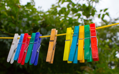 Plastic clothespins hanging on a clothesline