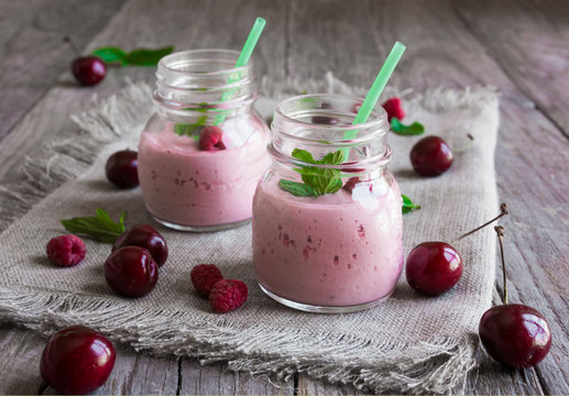 Milkshake with fresh cherries and raspberries