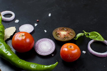 Spices and herbs for cooking dinner - ,slised tomato, onion, salt, pepper, garlic. © vimart