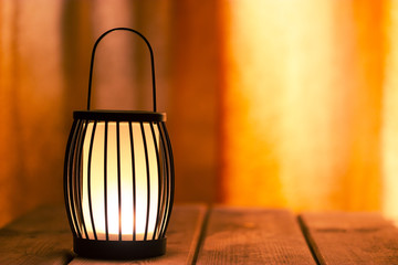 black lantern with a candle © lijphoto