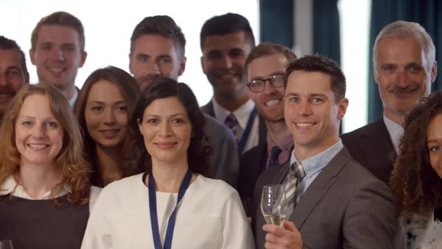 Portrait Of Delegates At Conference Standing In Lobby 