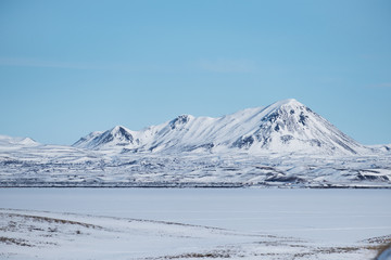 Fototapeta na wymiar Winter landscape, snow mountains with frozen lake and snow field
