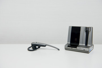 Telephone wireless headset on the white table