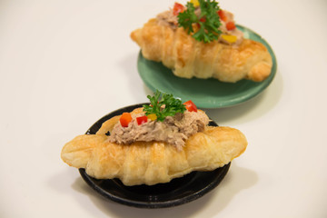 Croissant sandwich with  tuna on white
