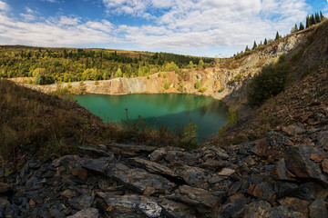 Fototapeta na wymiar Blue lake in Altai. This is a former copper mine that was flooded with water