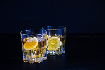 Glacc of cognac with ice and lime