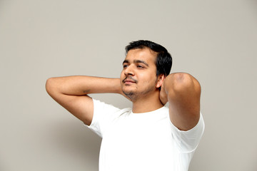 expressions of young amazed man isolated on gray background