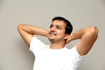 expressions of young amazed man isolated on gray background