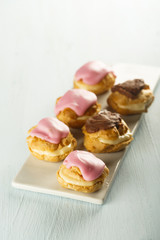 Assorted cream puff with rose and chocolate glaze