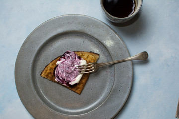 Swedish waffles with whipped cream and blueberry jam