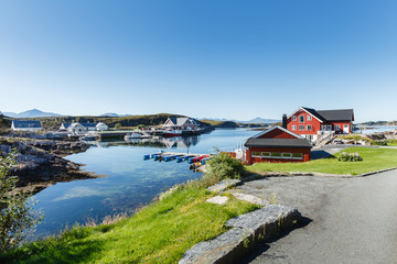 view on norwegian fjord with houses along coastline