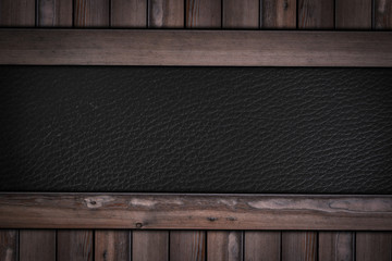 black leather texture pattern on wooden background