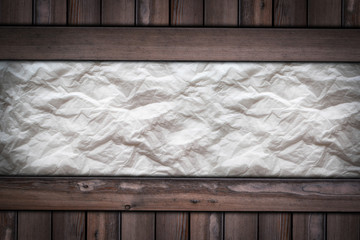 White page of paper texture on wooden background