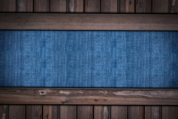 abstract blue jeans texture on wooden background