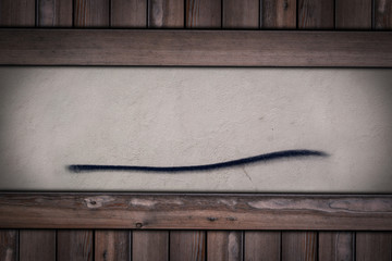 cement plaster wall with line on wooden background