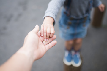 Parent and child playing in the park