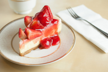 Close up strawberry cheesecake on white plate