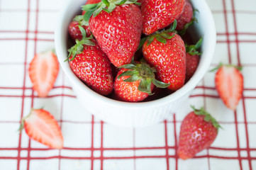 Close up fresh strawberries in white bowl