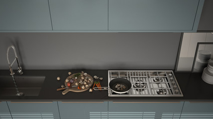 Modern kitchen with sink and stove, cooking pan and food, close-up, top view, gray and air force blue minimalist interior design