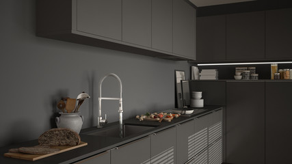 Modern kitchen with sink and stove, cooking pan and food, close-up, gray minimalist interior design