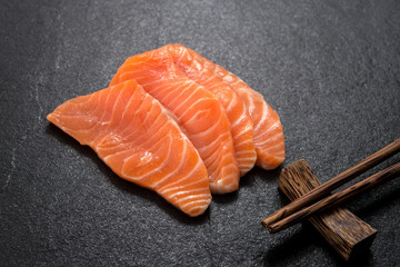 macro salmon with chopstick on marble 