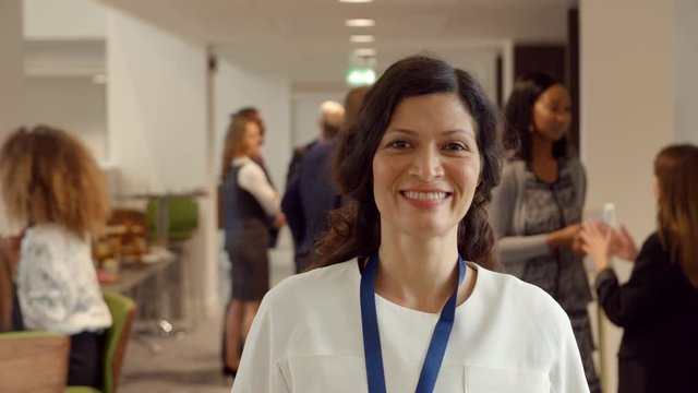 Portrait Of Female Delegate During Break At Conference