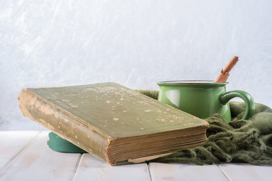 A book, coffee and a frozen window