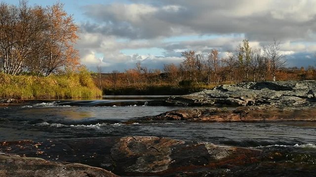 Small river stream in autumn at the mountain top in Finnmark