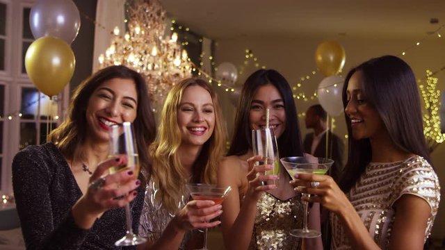 Female Friends Make Toast As They Celebrate At Party 