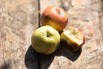 ripe apples on a wooden background
