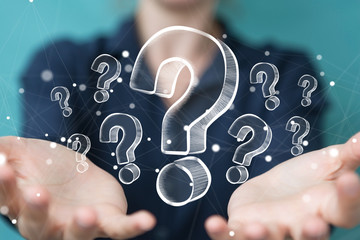 Businesswoman touching and holding hand drawn question marks