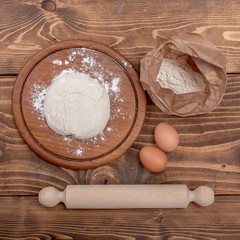 Food ingredients for dough a wooden kitchen board. Cake recipies
