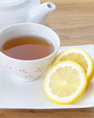 Cup of Lemon tea and fresh lemon slice