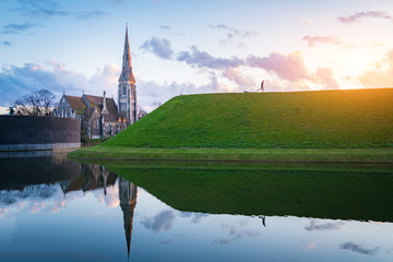 Beautful sunset St. Alban's church (Den engelske kirke) and fountain in Copenhagen, Denmark