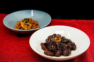 wok fried pork stir fry with sweet peppers and chinese vegetables