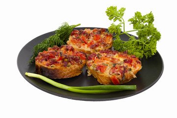 Mini pizza lies on a plate