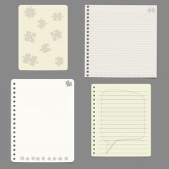 Fototapeta na wymiar Set of notebook paper sheets with puzzle, becycle and speech bubble designs on grey background. Vector illustration
