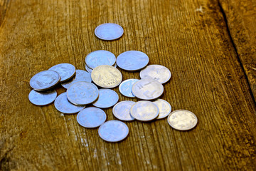 Indian coin on wooden texture ,