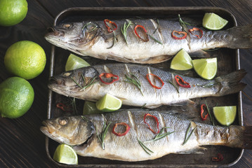 Baked sea bass with lime and chilli pepper