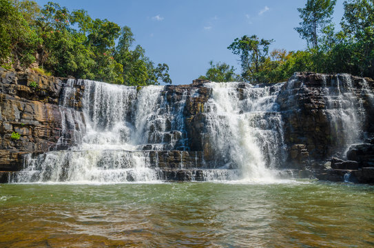 Beautiful Sala water falls near Labe with trees, green pool and a lot of water flow, Guinea Conakry, West Africa