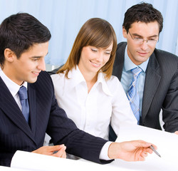 Fototapeta premium Three businesspeople working at office